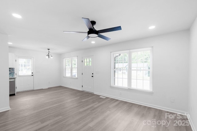 801 Evening Shade Ln, Gastonia, NC 28052 - foyer entrance featuring plenty of natural light, a chandelier, wood finished floors, a ceiling fan, and recessed lighting