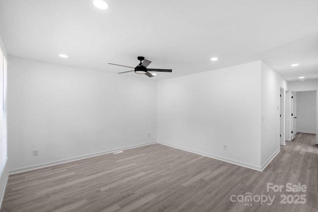 801 Evening Shade Ln, Gastonia, NC 28052 - spare room featuring wood finished floors, ceiling fan, and recessed lighting