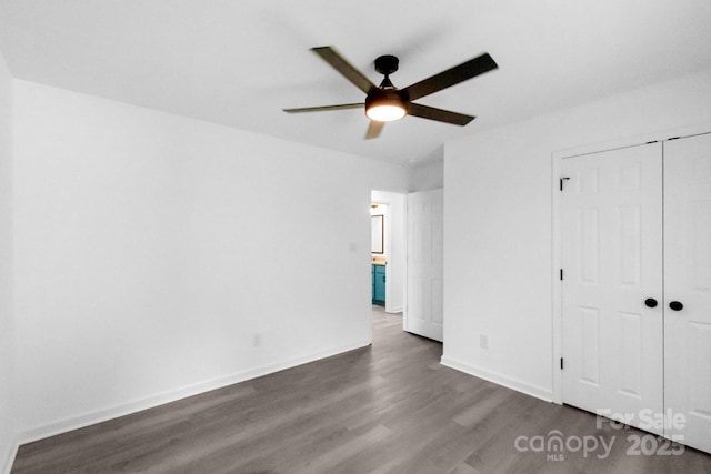 801 Evening Shade Ln, Gastonia, NC 28052 - unfurnished bedroom featuring dark wood-style floors, a closet, and ceiling fan