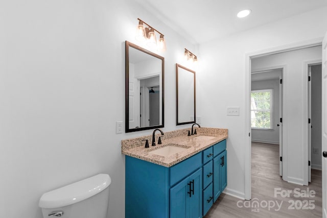 801 Evening Shade Ln, Gastonia, NC 28052 - bathroom featuring double vanity, wood finished floors, and recessed lighting