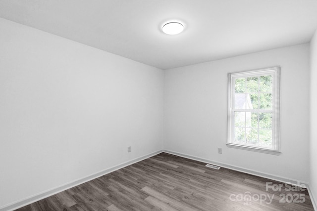801 Evening Shade Ln, Gastonia, NC 28052 - unfurnished room featuring dark wood-style floors and baseboards