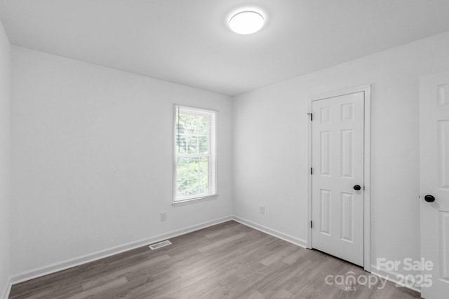 801 Evening Shade Ln, Gastonia, NC 28052 - spare room featuring wood finished floors and baseboards