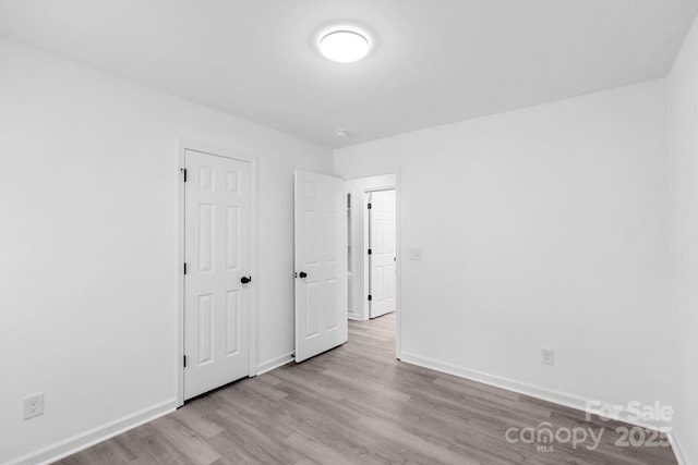 801 Evening Shade Ln, Gastonia, NC 28052 - unfurnished bedroom featuring wood finished floors