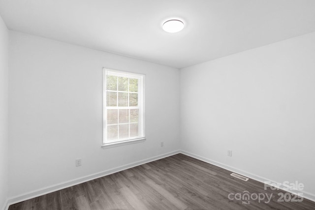 801 Evening Shade Ln, Gastonia, NC 28052 - empty room featuring dark wood finished floors and baseboards