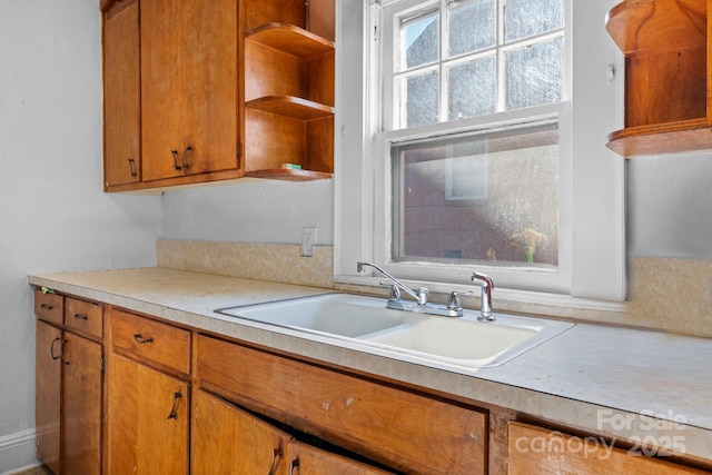 117 3rd Ave SW, Hickory, NC 28602 - kitchen with open shelves, light countertops, and brown cabinetry