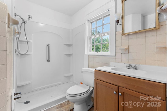 117 3rd Ave SW, Hickory, NC 28602 - bathroom featuring vanity, a shower, tasteful backsplash, and tile walls