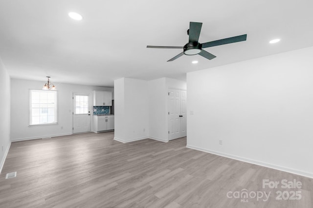 803 Evening Shade Ln, Gastonia, NC 28052 - unfurnished living room with ceiling fan, recessed lighting, and light wood finished floors