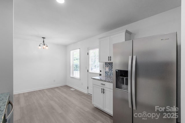 803 Evening Shade Ln, Gastonia, NC 28052 - kitchen with stainless steel fridge, light wood finished floors, white cabinetry, and light stone countertops