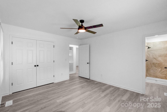 803 Evening Shade Ln, Gastonia, NC 28052 - unfurnished bedroom featuring wood finished floors, a closet, ensuite bathroom, and ceiling fan