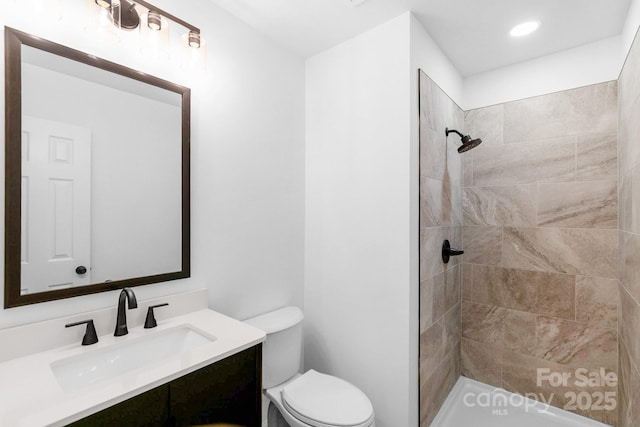 803 Evening Shade Ln, Gastonia, NC 28052 - bathroom featuring vanity, a tile shower, and recessed lighting