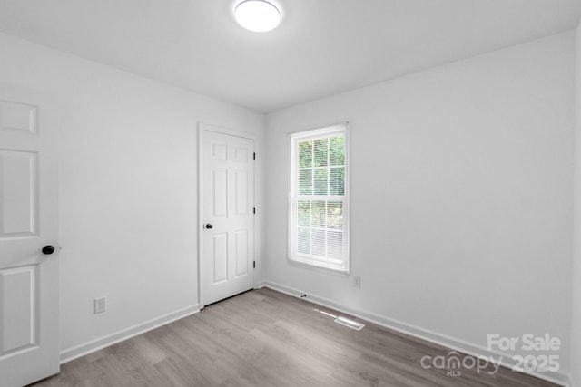 803 Evening Shade Ln, Gastonia, NC 28052 - unfurnished bedroom with wood finished floors and baseboards