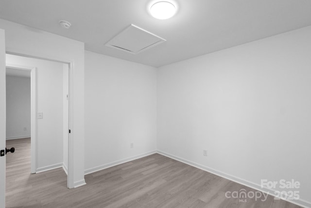 803 Evening Shade Ln, Gastonia, NC 28052 - spare room with wood finished floors, attic access, and a smoke detector