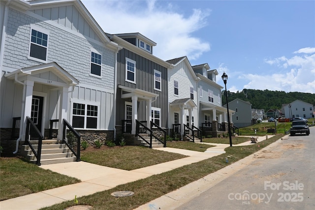 185 Cherry Springs Ln Unit 24-C, Asheville, NC 28804 - townhome / multi-family property featuring board and batten siding, a residential view, and a front lawn