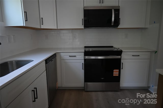 185 Cherry Springs Ln Unit 24-C, Asheville, NC 28804 - kitchen with appliances with stainless steel finishes, dark wood finished floors, white cabinetry, and light countertops