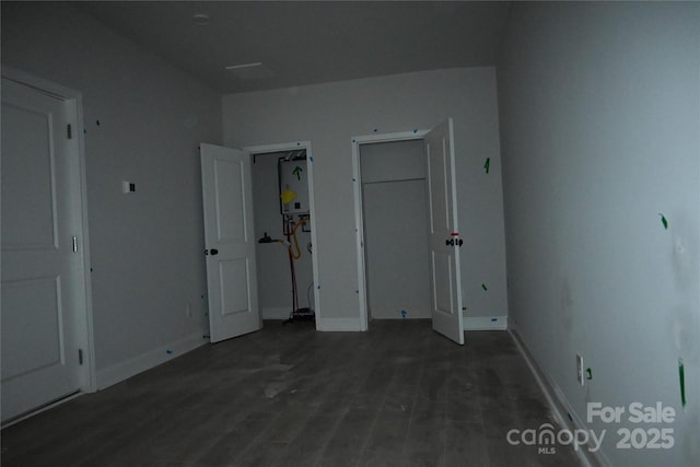 185 Cherry Springs Ln Unit 24-C, Asheville, NC 28804 - unfurnished bedroom featuring wood finished floors and water heater