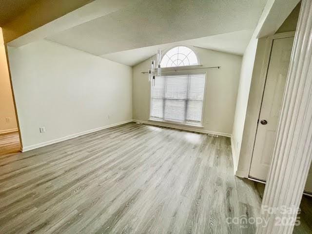 205 Hidden Spring Dr, Salisbury, NC 28147 - unfurnished room with wood finished floors and vaulted ceiling