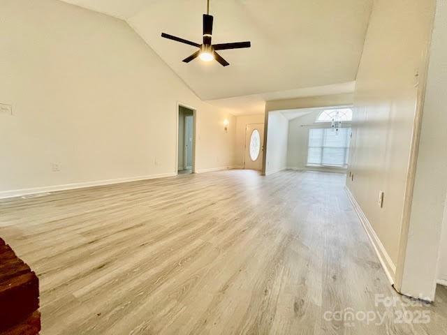 205 Hidden Spring Dr, Salisbury, NC 28147 - unfurnished living room with light wood-type flooring, ceiling fan, and high vaulted ceiling
