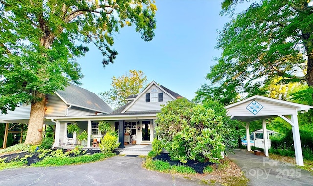 227 Reep Dr, Morganton, NC 28655 - view of front of home featuring covered porch, a carport, and driveway