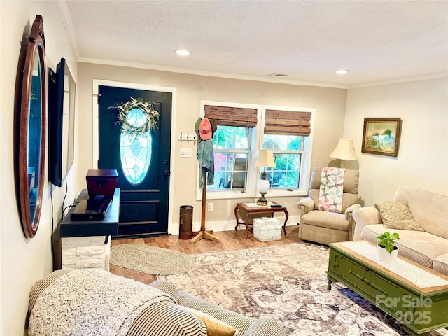 227 Reep Dr, Morganton, NC 28655 - living area with wood finished floors, ornamental molding, a textured ceiling, and recessed lighting