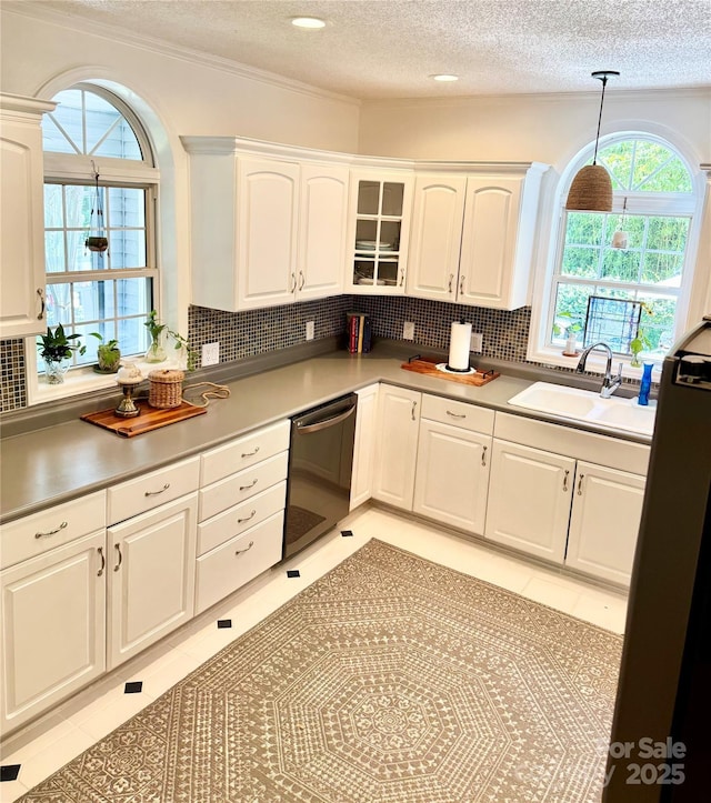 227 Reep Dr, Morganton, NC 28655 - kitchen featuring stainless steel dishwasher, a textured ceiling, white cabinetry, decorative backsplash, and decorative light fixtures
