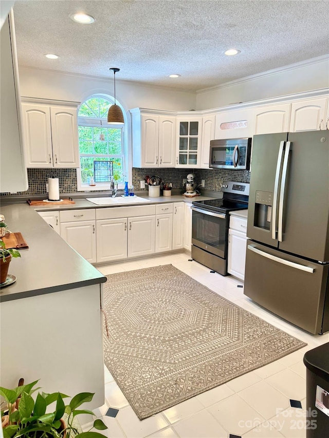 227 Reep Dr, Morganton, NC 28655 - kitchen featuring stainless steel appliances, white cabinetry, backsplash, a textured ceiling, and recessed lighting