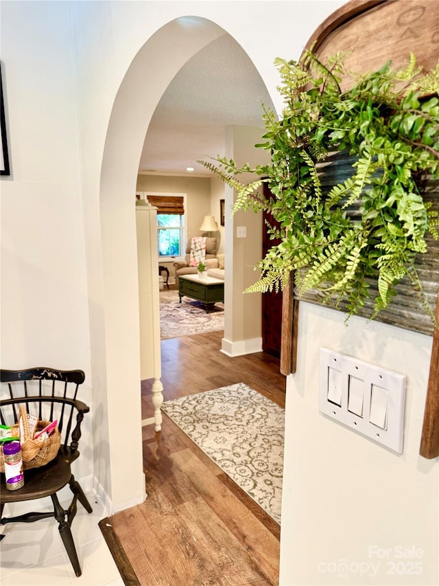 227 Reep Dr, Morganton, NC 28655 - hall with arched walkways and wood finished floors