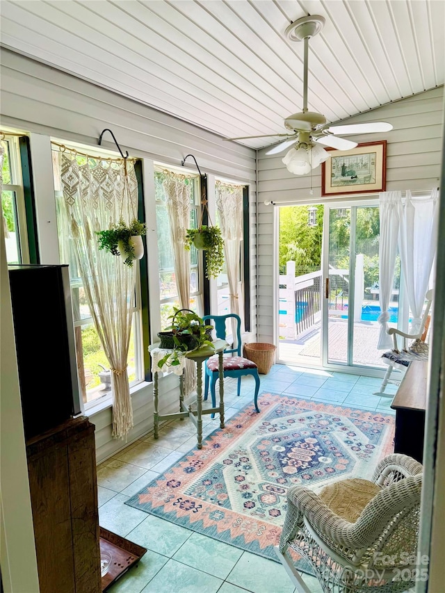 227 Reep Dr, Morganton, NC 28655 - sunroom with a ceiling fan, tile patterned floors, and wood walls