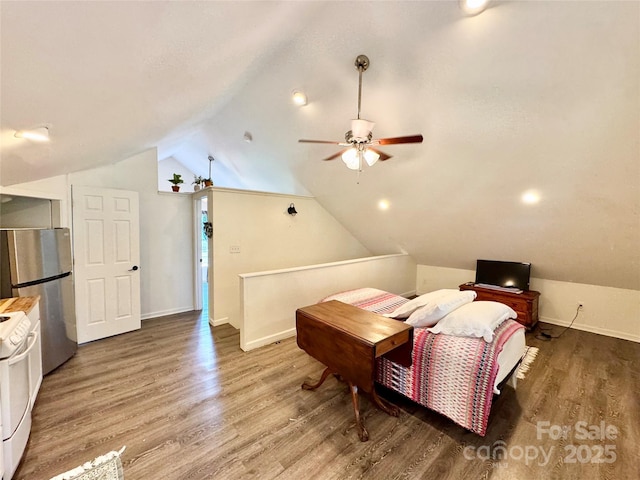 227 Reep Dr, Morganton, NC 28655 - bedroom featuring freestanding refrigerator, wood finished floors, and lofted ceiling