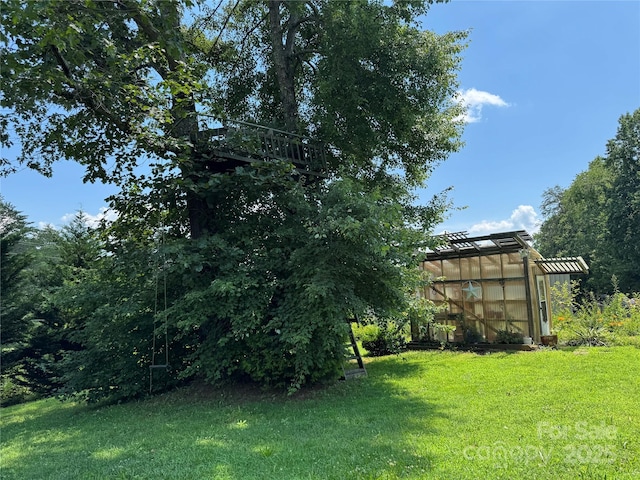 227 Reep Dr, Morganton, NC 28655 - view of grassy yard featuring a greenhouse and an outdoor structure