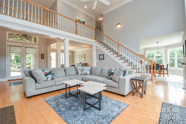 9221 Belle Pines Ct, Sherrills Ford, NC 28673 - living area with a towering ceiling, ornamental molding, stairs, wood finished floors, and a ceiling fan