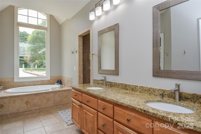 9221 Belle Pines Ct, Sherrills Ford, NC 28673 - bathroom featuring a bath, double vanity, tile patterned flooring, and lofted ceiling