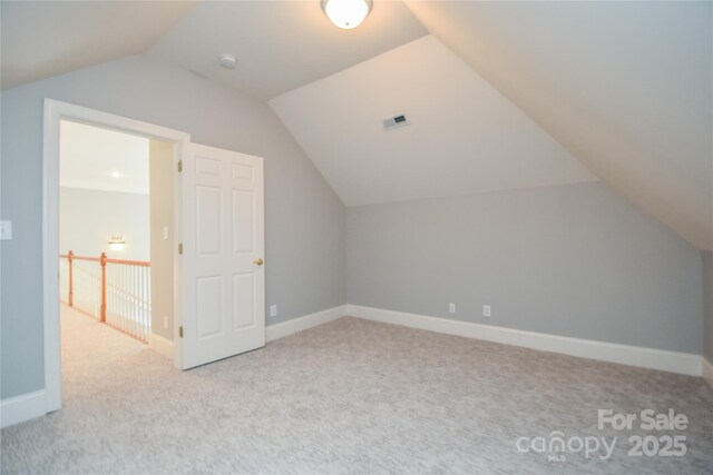 9221 Belle Pines Ct, Sherrills Ford, NC 28673 - additional living space with carpet floors and vaulted ceiling