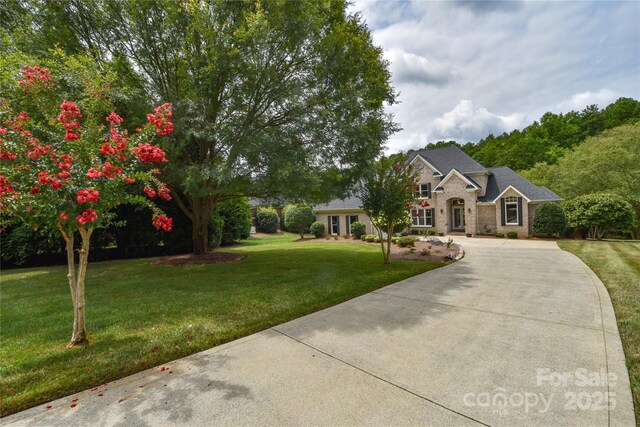 9221 Belle Pines Ct, Sherrills Ford, NC 28673 - view of front of property with curved driveway, a front lawn, and brick siding