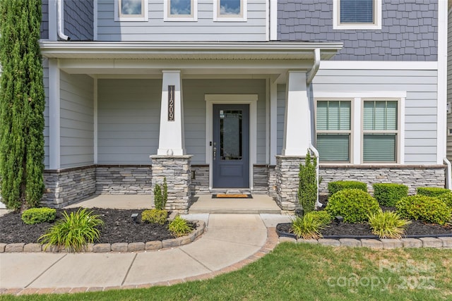 11209 Flenniken Ct, Charlotte, NC 28277 - view of exterior entry with stone siding and covered porch