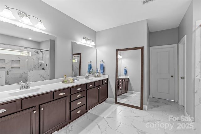 11209 Flenniken Ct, Charlotte, NC 28277 - bathroom featuring marble look tiles, double vanity, and a marble finish shower
