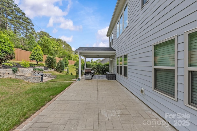 11209 Flenniken Ct, Charlotte, NC 28277 - fenced backyard with a patio and grilling area