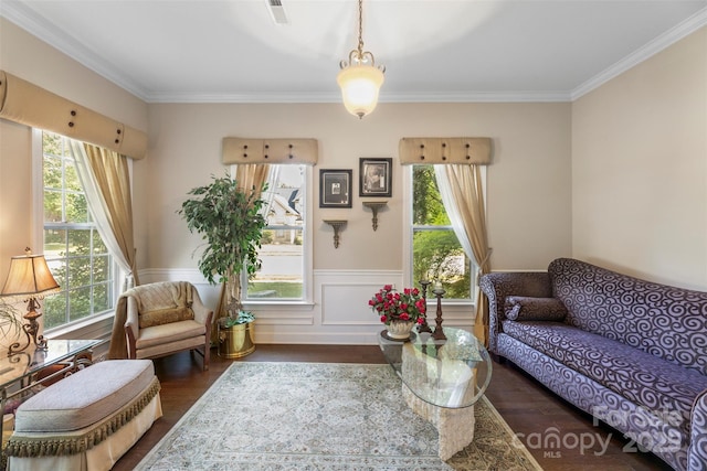 1204 Vaugelas Ct, Monroe, NC 28110 - living room featuring healthy amount of natural light, wood finished floors, crown molding, and a wainscoted wall