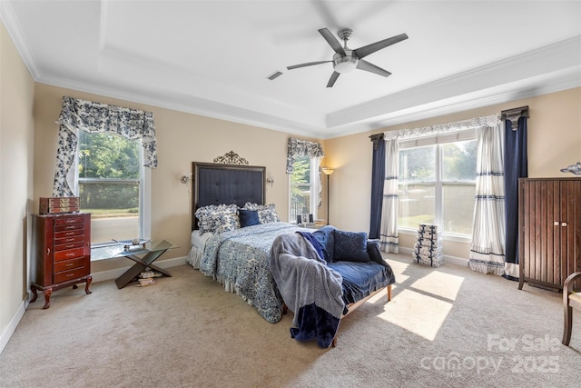 1204 Vaugelas Ct, Monroe, NC 28110 - carpeted bedroom with a tray ceiling, multiple windows, ornamental molding, and a ceiling fan