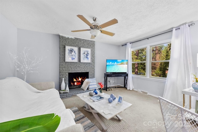 107 Laura Springs Dr, Salisbury, NC 28146 - carpeted living area with a brick fireplace, a ceiling fan, and a textured ceiling
