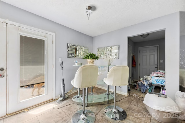 107 Laura Springs Dr, Salisbury, NC 28146 - tiled dining space featuring a textured ceiling