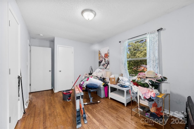 107 Laura Springs Dr, Salisbury, NC 28146 - recreation room featuring a textured ceiling and wood finished floors
