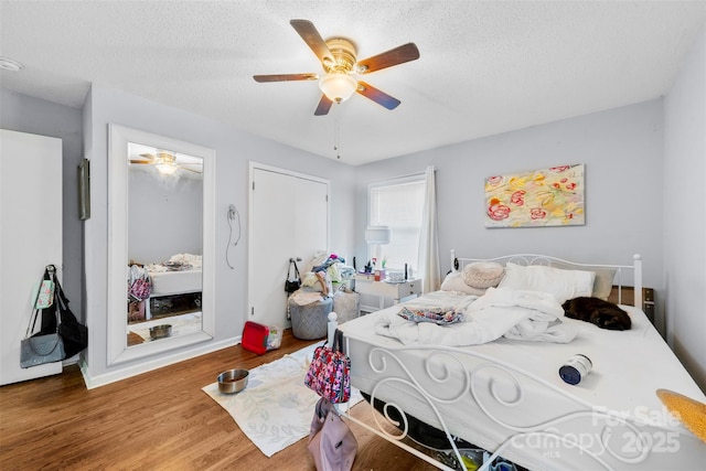107 Laura Springs Dr, Salisbury, NC 28146 - bedroom featuring wood finished floors, a textured ceiling, and ceiling fan