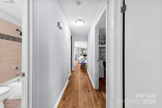 107 Laura Springs Dr, Salisbury, NC 28146 - hallway with a textured ceiling and wood finished floors