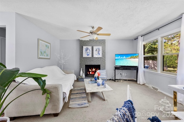 107 Laura Springs Dr, Salisbury, NC 28146 - carpeted living area featuring a brick fireplace, ceiling fan, and a textured ceiling