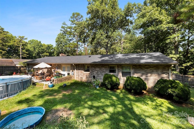 107 Laura Springs Dr, Salisbury, NC 28146 - rear view of property with a chimney and brick siding