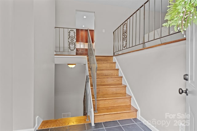 15 Beaverdam Ct, Asheville, NC 28804 - stairway featuring tile patterned flooring and baseboards