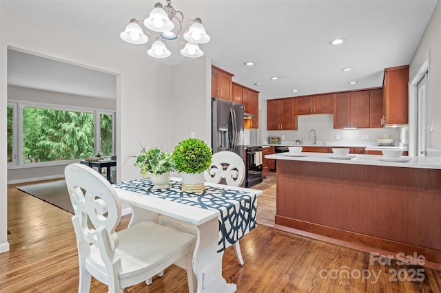 15 Beaverdam Ct, Asheville, NC 28804 - dining area featuring light wood-style flooring, a chandelier, and recessed lighting