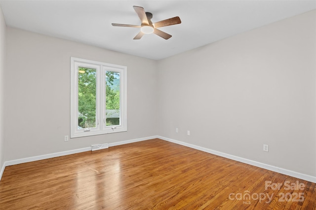 15 Beaverdam Ct, Asheville, NC 28804 - spare room with a ceiling fan and wood finished floors