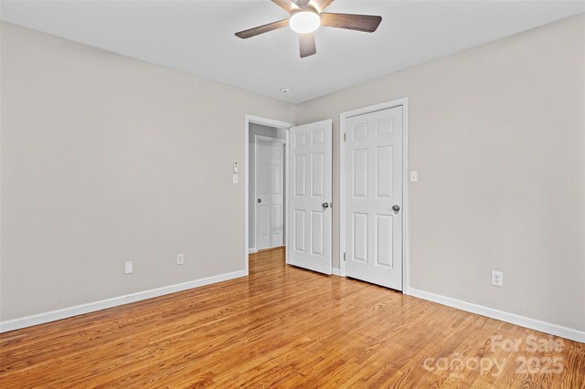 15 Beaverdam Ct, Asheville, NC 28804 - unfurnished bedroom with light wood-type flooring and ceiling fan