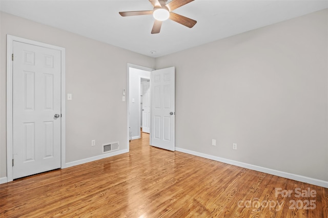 15 Beaverdam Ct, Asheville, NC 28804 - unfurnished bedroom with light wood-style floors and ceiling fan